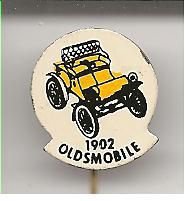 Oldsmobile 1902 geel blik auto speldje ( H_004 ) - 1