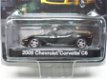 2009 Chevrolet Corvette C6 Zwart / Geel 1:64 Greenlight - 1 - Thumbnail