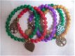 okergeel bruin parelmoer parel armband met bronzen bedel - 1 - Thumbnail