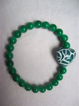 mooie parelmoer parel armband met groen keramiek hart - 1