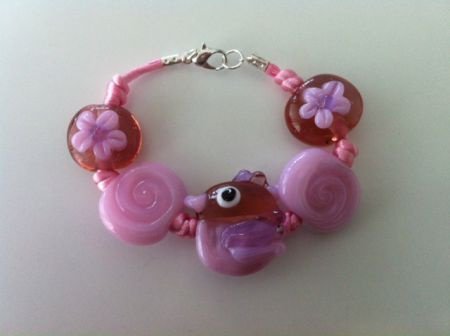 Uniek kinderarmband en ketting roze met vogel. - 1