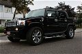 Hummer H2 SUT huren of rijden in het wit en zwart - 1 - Thumbnail