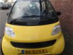 Sloopauto inkoop Den haag Smart Geel voor onderdelen - 1 - Thumbnail