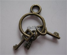 bedeltje/charm sleutel:sleutelbos brons - 27 mm