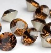 Swarovski 1028 Smoked Topaz 7mm ss29 Per Stuk. - 1