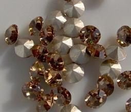 Swarovski 1028 Light Colorado Topaz 7mm ss29 Per Stuk. - 1