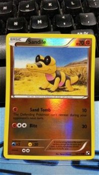 Sandile - 63/114 (reverse foil) Black and White - 1