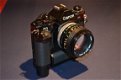 Komplete set Canon fotoapparatuur F-1 en A-1 in nieuwstaat - 2 - Thumbnail