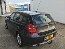 BMW 1-serie - 116i 85kW met Navigatiesysteem en maar 155DKM