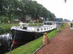 Varend woonschip met CVO keuring en ligplaats in overleg - 1 - Thumbnail