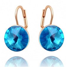 prachtige oorbellen 18k goud met swarovski kristal licht blauw