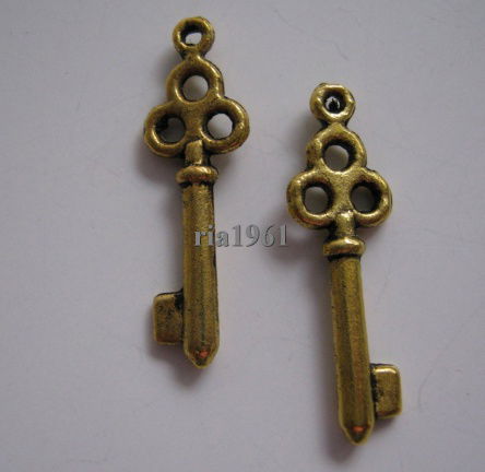 bedeltje/charm op=op :sleutel 02 goud - 21x6 mm (nog 12 st.) - nr. 1