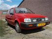 Nissan Micra - 1.0 DX handgeschakeld - 1 - Thumbnail