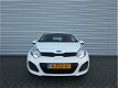 Kia Rio - 1.2 CVVT COMFORTLINE | 5-Drs | Airco | 7 Jr Gar | Dealeronderhouden | Navi | - 1 - Thumbnail