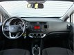 Kia Rio - 1.2 CVVT COMFORTLINE | 5-Drs | Airco | 7 Jr Gar | Dealeronderhouden | Navi | - 1 - Thumbnail