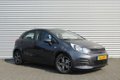 Kia Rio - 1.2 CVVT COMFORTSPORTSLINE | 5-Drs | LM Velgen | Airco | Cruise | 7 Jr Gar | Navi | - 1 - Thumbnail