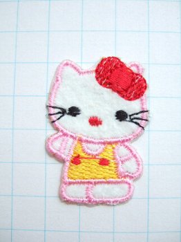 Roze Hello Kitty met rode strik, strijkapplicatie ~ 4 cm - 0