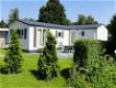 T.h. nette chalet(caravan)s en kampeerplaatsen camping-vakantiepark Stelleplas - 1 - Thumbnail