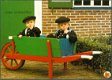 KLEDERDRACHT Staphorst, twee jongetjes in dracht in kruiwagen - 1 - Thumbnail