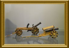 Twee antieke ijzeren miniatuur speelgoed kanonnen