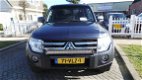 Mitsubishi Pajero - 3.2 DI-D INTENSE SIDE WINDOW VAN 4WD AUT. GRIJS KENTEKEN - 1 - Thumbnail