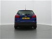 Ford Focus Wagon - 1.5 TDCI *NW.MODEL* EDITION / NAVI / AIRCO / CRUISE CTR. / LMV / PDC / *APK 4-202 - 1 - Thumbnail