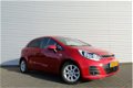 Kia Rio - 1.2 CVVT DYNAMICLINE | 5-Drs | LED | Airco | Cruise | 7 jaar garantie | Navi | - 1 - Thumbnail