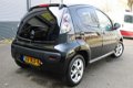 Citroën C1 - 1.0 First Edition 5 DRS GETINTE RAMEN LICHTMETALEN VELGEN AIRCON - 1 - Thumbnail