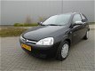 Opel Corsa - 1.2-16V Njoy Zwart Bouwjaar 2003 - 1 - Thumbnail