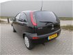 Opel Corsa - 1.2-16V Njoy Zwart Bouwjaar 2003 - 1 - Thumbnail