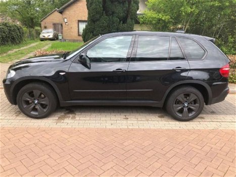 BMW X5 - 3.0d Executive (vier winterbanden + velgen) - 1