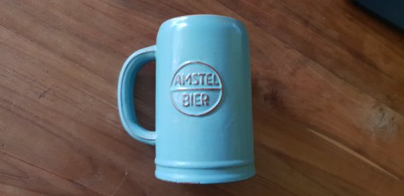 uitvegen Schrijft een rapport voering Stenen bierpul van Amstel bier