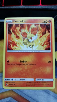 Fennekin  14/131  Common S & M Forbidden Light