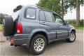 Suzuki Grand Vitara - 2.0i met Leder, Airco en Vele Opties - 1 - Thumbnail