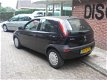 Opel Corsa - 1.0-12V Comfort - 1 - Thumbnail