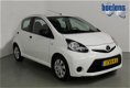 Toyota Aygo - 1.0 VVT-I 5drs NOW AIRCO, ELEK RAMEN, 1E EIGENAAR - 1 - Thumbnail