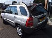 Kia Sportage - 2.0 CVVT COMFORT CLIMA CRUISE NIEUWE APK - GARANTIE - € 4.190 MARGE Auto in zeer nett - 1 - Thumbnail