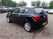 Opel Corsa - 1.4-16V 90pk 5Drs Favourite Navigatie Parkpilot Cruise LMV - 1 - Thumbnail