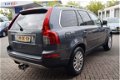 Volvo XC90 - 2.4 D5 R-Design 7-PERS/BRUIN LEDER/NAVI/CRUISE/TREKHAAK - 1 - Thumbnail