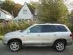 Hyundai Santa Fe - 2.4i-16V Elite 146pk Leder Schuifdak Trekhaak 2000kg - 1 - Thumbnail