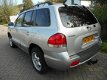 Hyundai Santa Fe - 2.4i-16V Elite 146pk Leder Schuifdak Trekhaak 2000kg - 1 - Thumbnail