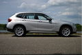 BMW X1 - 1.8d sDrive Executive RIJKLAAR PRIJS-GARANTIE Navigatie Leder Interieur Panoramadak Trekha - 1 - Thumbnail