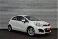 Kia Rio - 1.2 CVVT ComfortLine | Airco | Dealeronderhouden | 1e eigenaar | Bluetooth | Navi | - 1 - Thumbnail