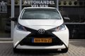 Toyota Aygo - Aygo 1.0 VVT-I 5drs X-NOW AIRCO|LED| |NAP| APK 2-2021 - 1 - Thumbnail