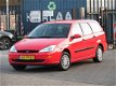 Ford Focus Wagon - 1.4-16V Ambiente - 1 - Thumbnail