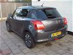 Suzuki Swift - 1.2 5drs stijl full options navigatie cruise enz - 1 - Thumbnail