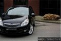 Opel Corsa - 1.4-16V Enjoy 5DRS AIRCO CRUISE 93dkm NAP NW APK - 1 - Thumbnail