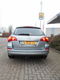 Opel Astra Sports Tourer - 1.4 TURBO BERLIN/ NAVIGATIE/ TREKHAAK/ PDC/ INCL. 6 MND BOVAG GARANTIE - 1 - Thumbnail