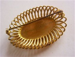 Oude broche met parelmoer