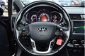 Kia Rio - 1.2 Design Edition Navi/Cruise/PDC/LM velgen/LED - 1 - Thumbnail